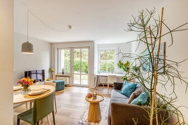 Appartement meublé au rez-de-chaussée avec jardin privé